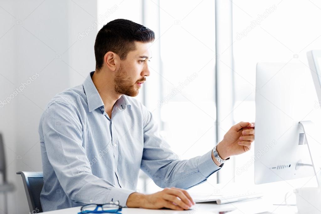 Depositphotos 106804076 Stock Photo Male Office Worker Sitting At